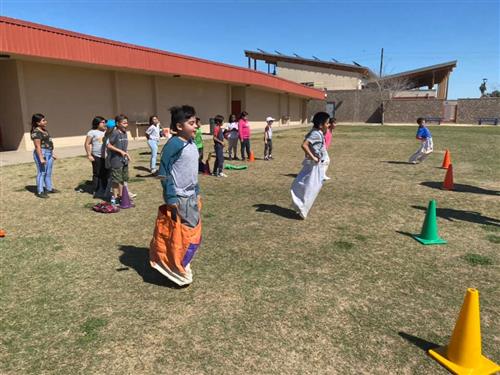 students run during field day